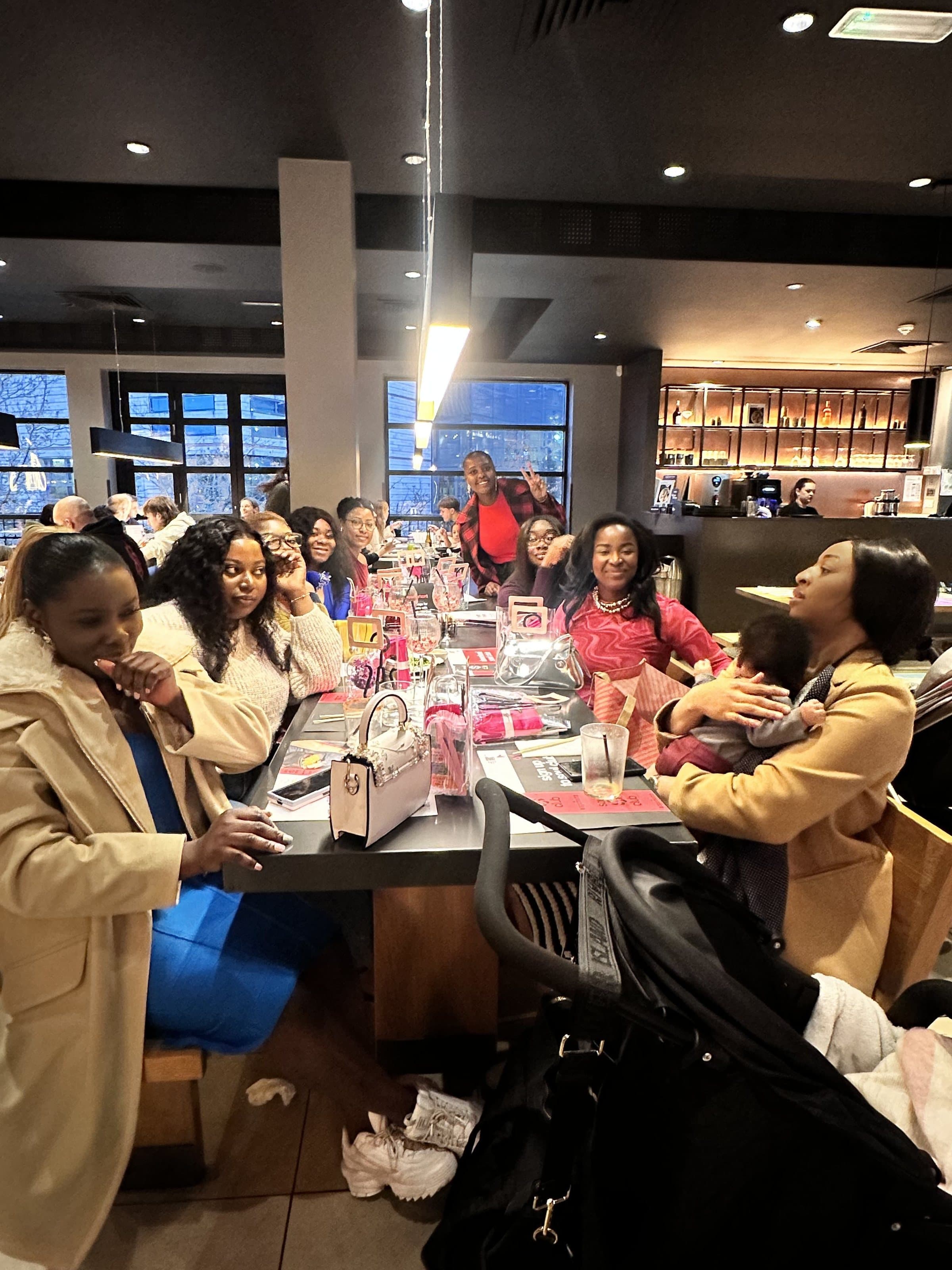 The Bloom & Become community together around the table at a Blooming Sips gathering